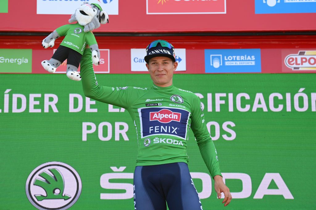 ALTO DE LA MONTAA DE CULLERA SPAIN AUGUST 19 Jasper Philipsen of Belgium and Team AlpecinFenix celebrates winning the Green Points Jersey on the podium ceremony after the 76th Tour of Spain 2021 Stage 6 a 1583km stage from Requena to Alto de la Montaa de Cullera 184m lavuelta LaVuelta21 on August 19 2021 in Alto de la Montaa de Cullera Spain Photo by Stuart FranklinGetty Images
