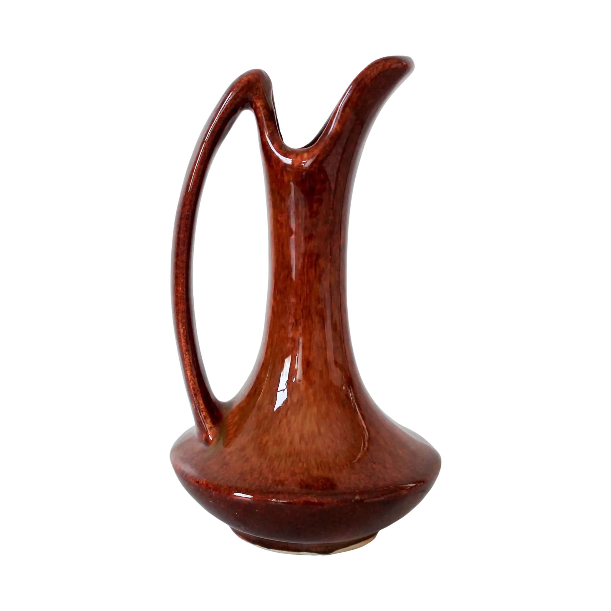 a glazed brown vase with a handle