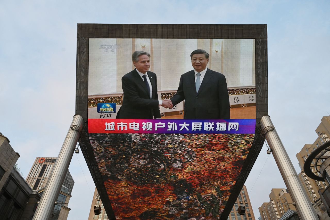 A TV shows Secretary of State Antony Blinken meeting with China&amp;#039;s President Xi Jinping