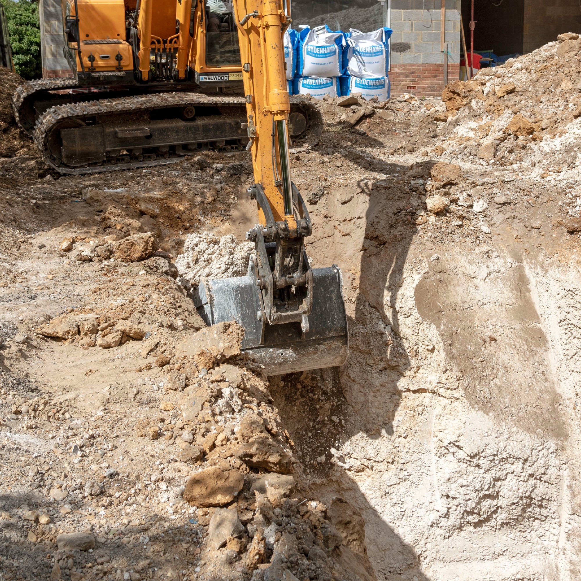 Excavating trenches for extension foundations