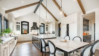 large white and black kitchen with vaulted ceiling
