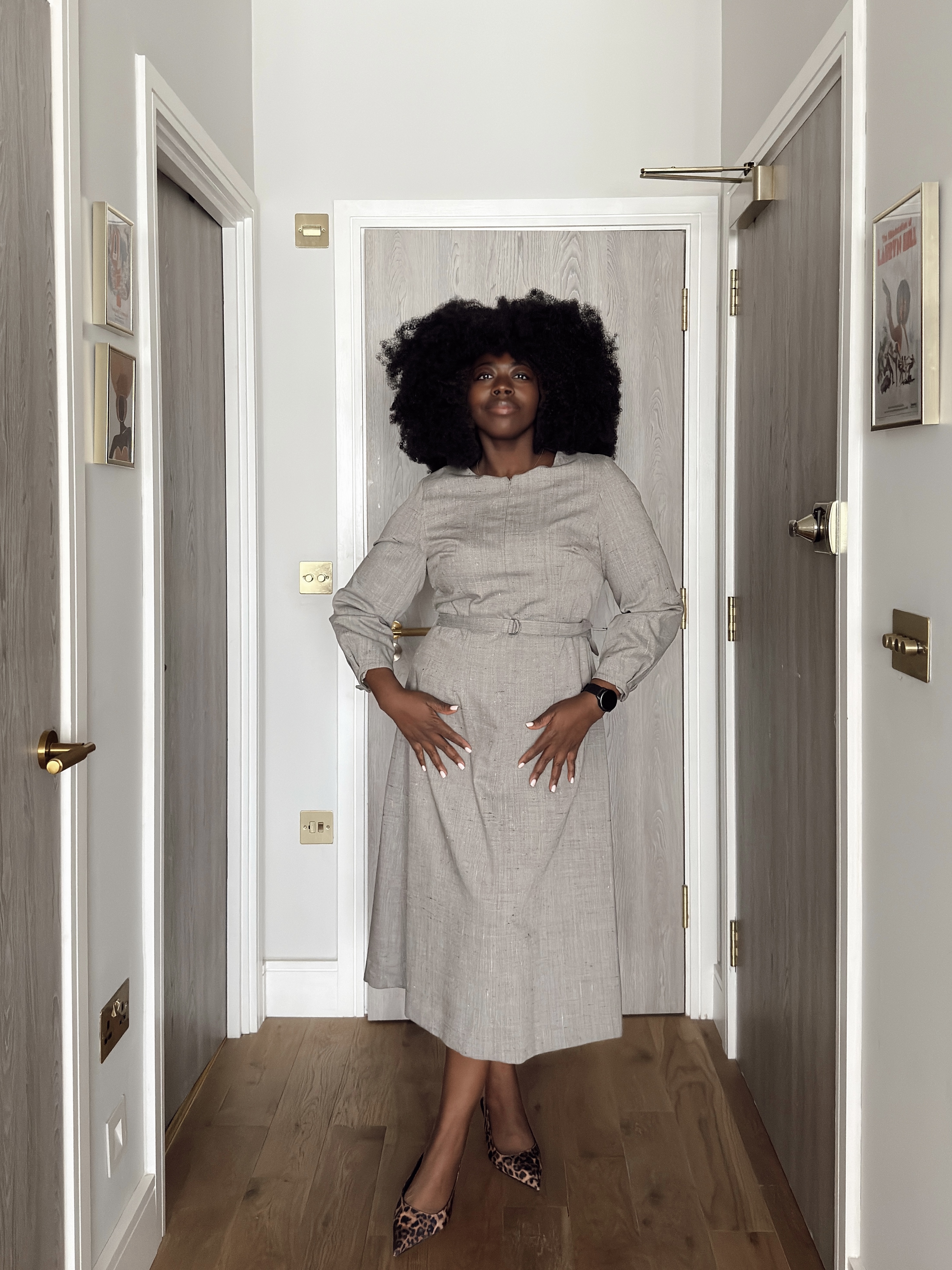 stephanie yeboah wearing a tailored grey workwear dress from jaeger