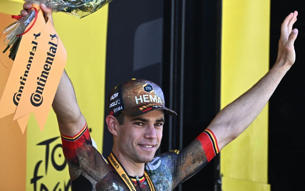 JumboVisma teams Belgian rider Wout Van Aertcelebrates on the podium after winning the 8th stage of the 109th edition of the Tour de France cycling race 1863 km between Dole in eastern France and Lausanne in Switzerland on July 9 2022 Photo by AnneChristine POUJOULAT AFP Photo by ANNECHRISTINE POUJOULATAFP via Getty Images