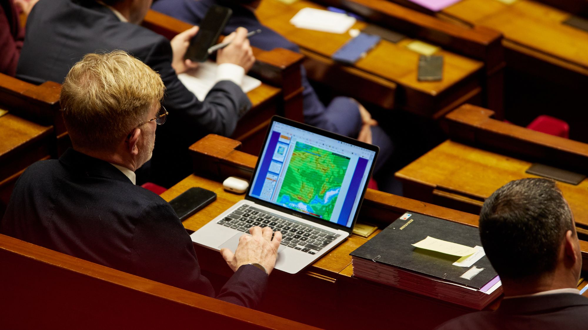 French politician on a laptop
