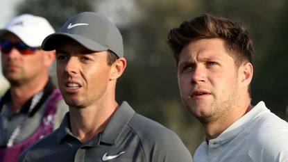 Niall Horan (right) and Rory McIlroy look on at the 2018 Dubai Desert Classic