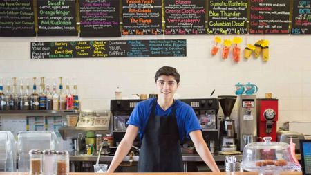 teen worker in juice bar