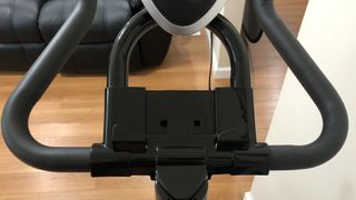 A photo of the phone holder on the Yosuda Indoor Stationary Cycling Bike