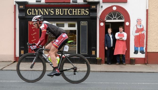 Butcher John Glynn an his mother Eileen watch the Ras fly by