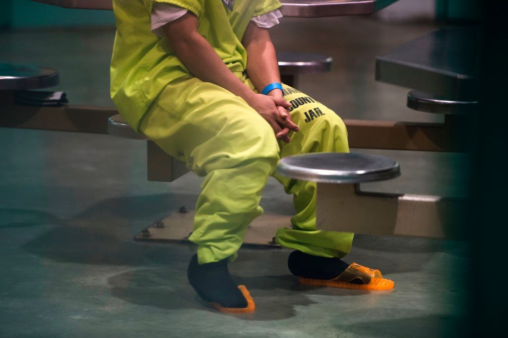 An immigration detainee sits in a California jail.