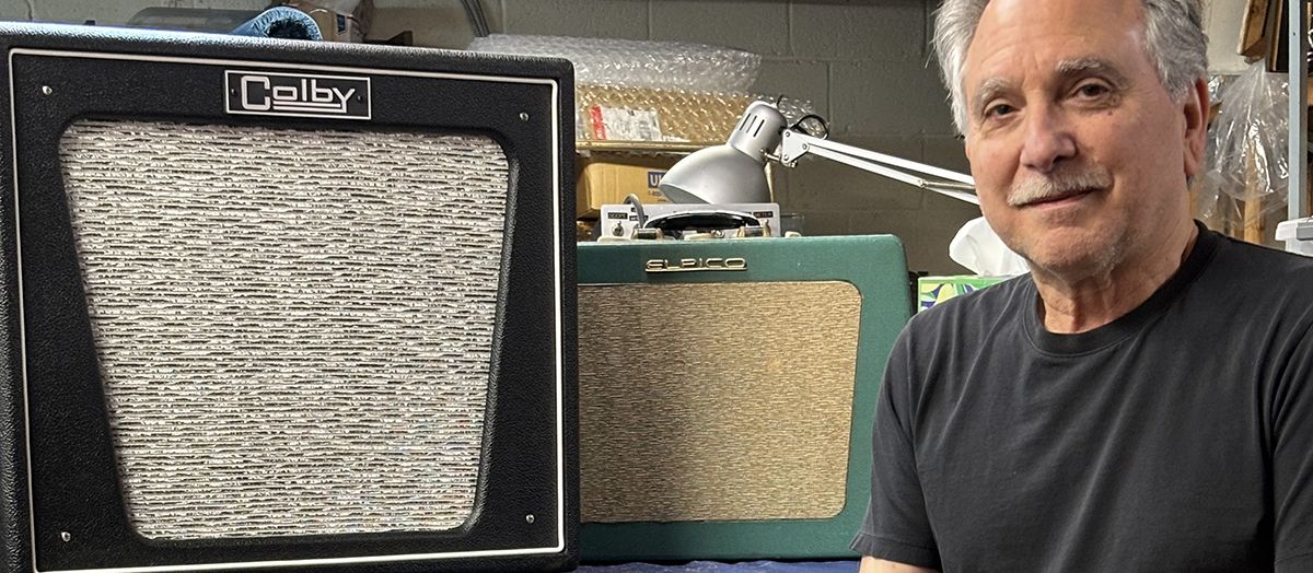 Mitch Colby poses with an original Elpico AC55 combo (center) and his Colby Elpico AC55 1x12 combo.