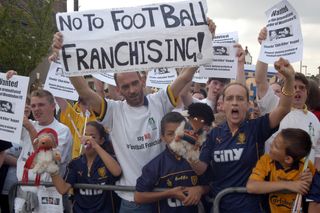 Wimbledon fans protest against the proposed relocation of the club to Milton Keynes, 2002