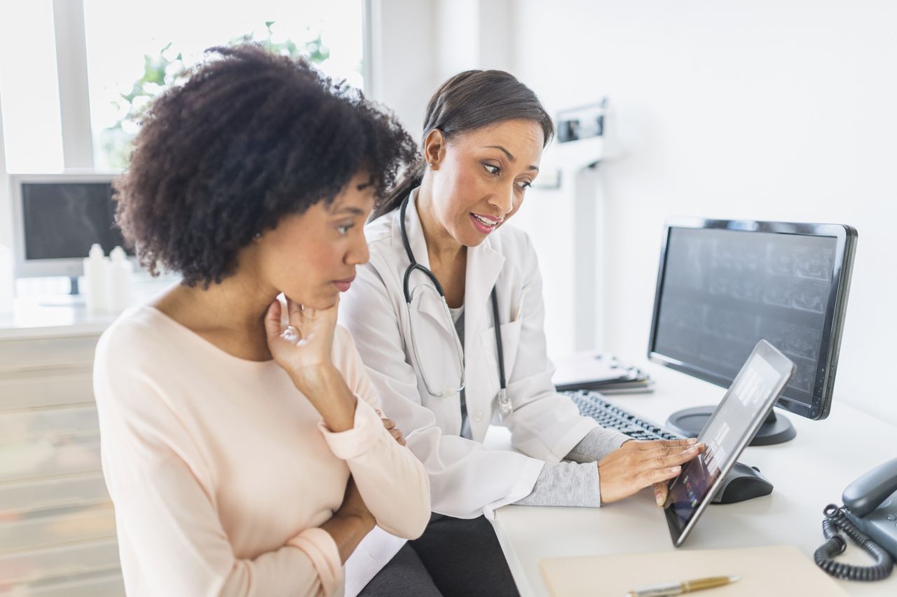 Doctor and patient talking in office