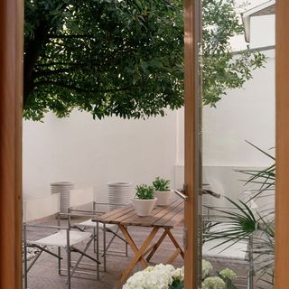 garden terrace seating with wooden table