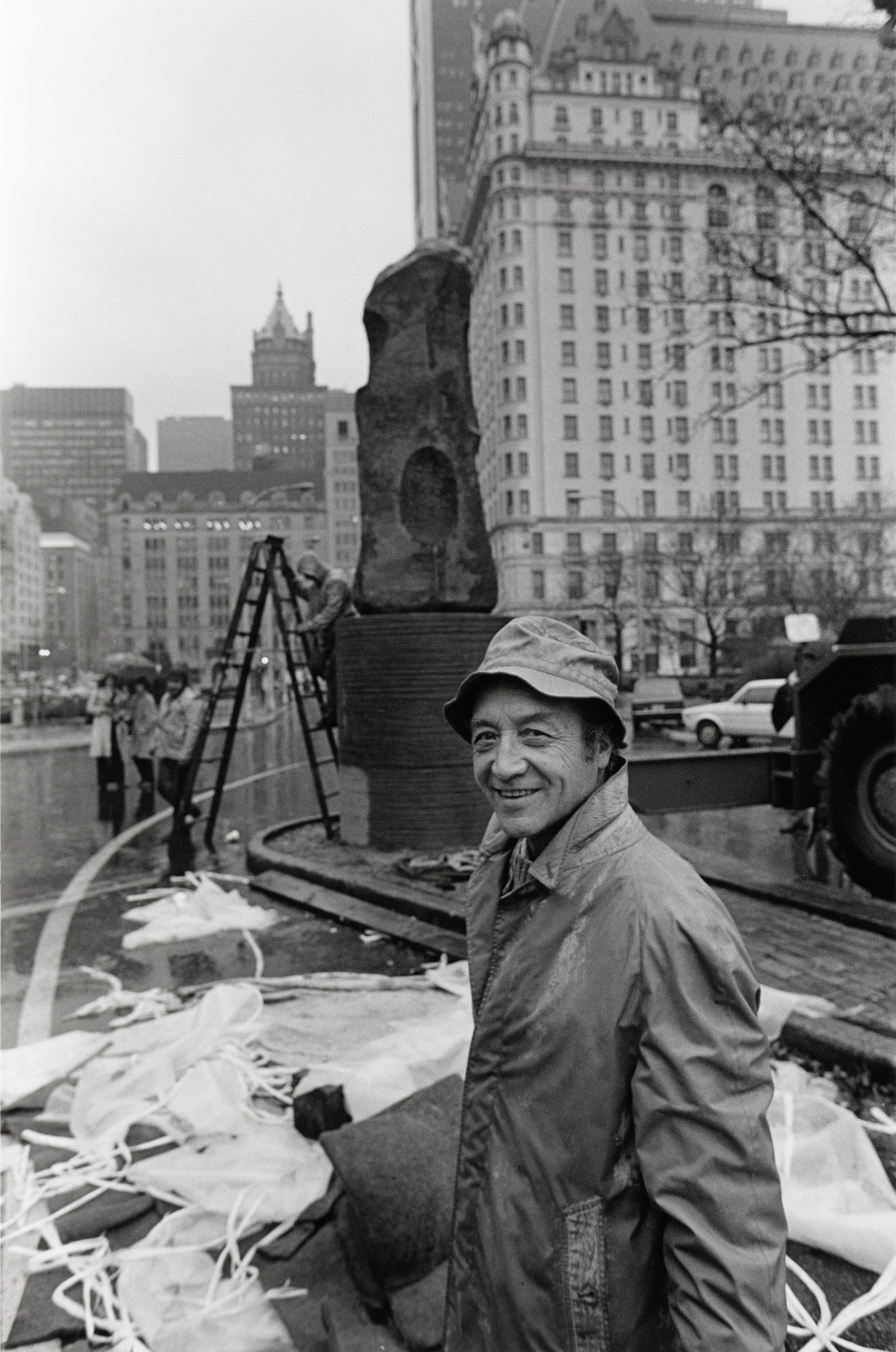 Isamu Noguchi stands in front of the Plaza Hotel at the debut of his first public sculpture on New York City land called Unidentified Object in 1979.