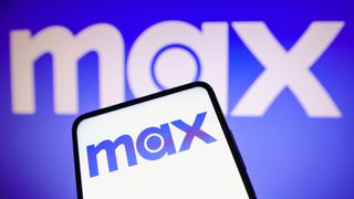 Max streaming service logo on phone with Max logo on a blue background