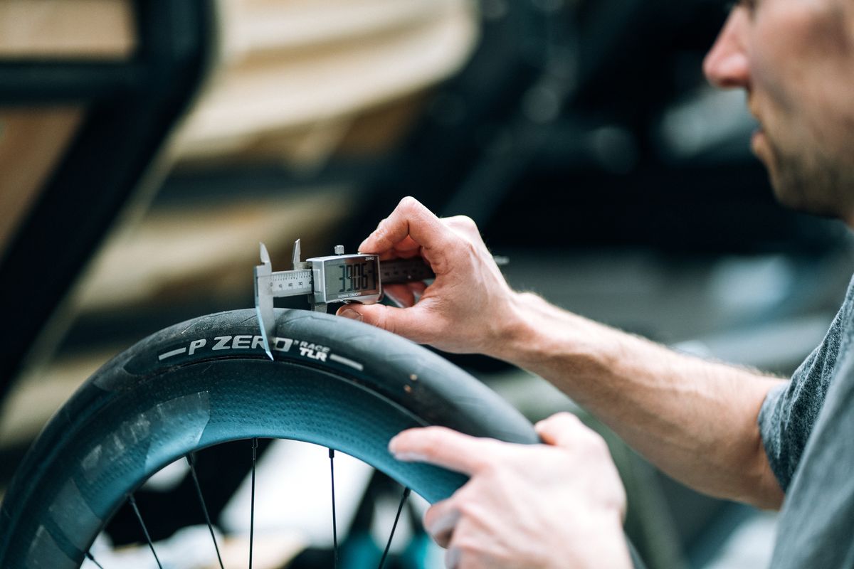 Tom Wieckowski measures the width of a road tyre