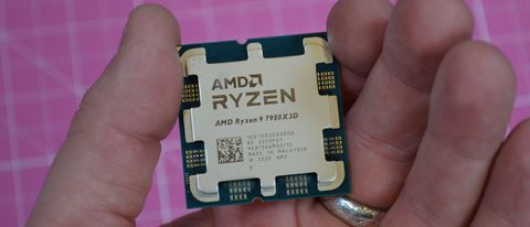 An AMD Ryzen 9 7950X3D held between a man's fingers