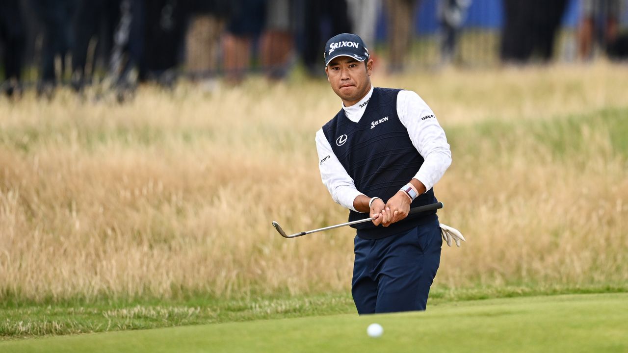 Hideki Matsuyama plays his shot onto the 16th green during the Open.