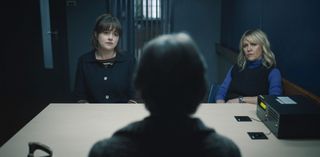 Tosh (Alison O'Donnell) and Calder (Ashley Jensen) sit in a police interview room across the table from Grace Bain (Phyllis Logan), who has her back to the camera