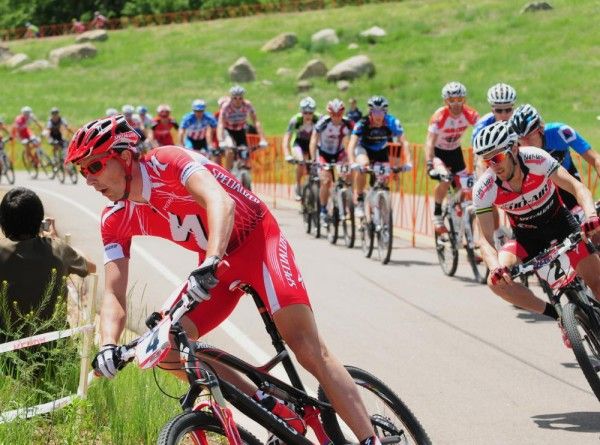 Todd Wells (Specialized) leads riders onto the dirt.