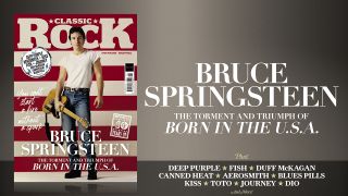 The cover of Classic Rock 330, featuring Briuce Springsteen posing in front of a US flag holding a guitar