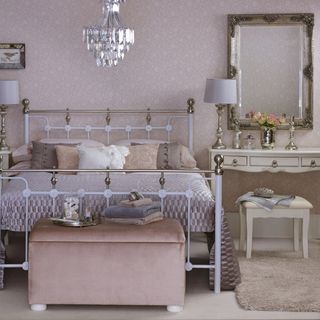 bedroom with chandelier and mirror