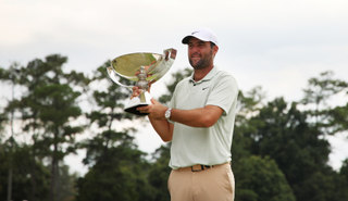 Scottie Scheffler holds the FedEx Cup trophy