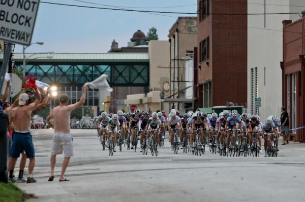The women get cheered on by fans along the back side