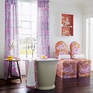 bathroom with curtains and chairs