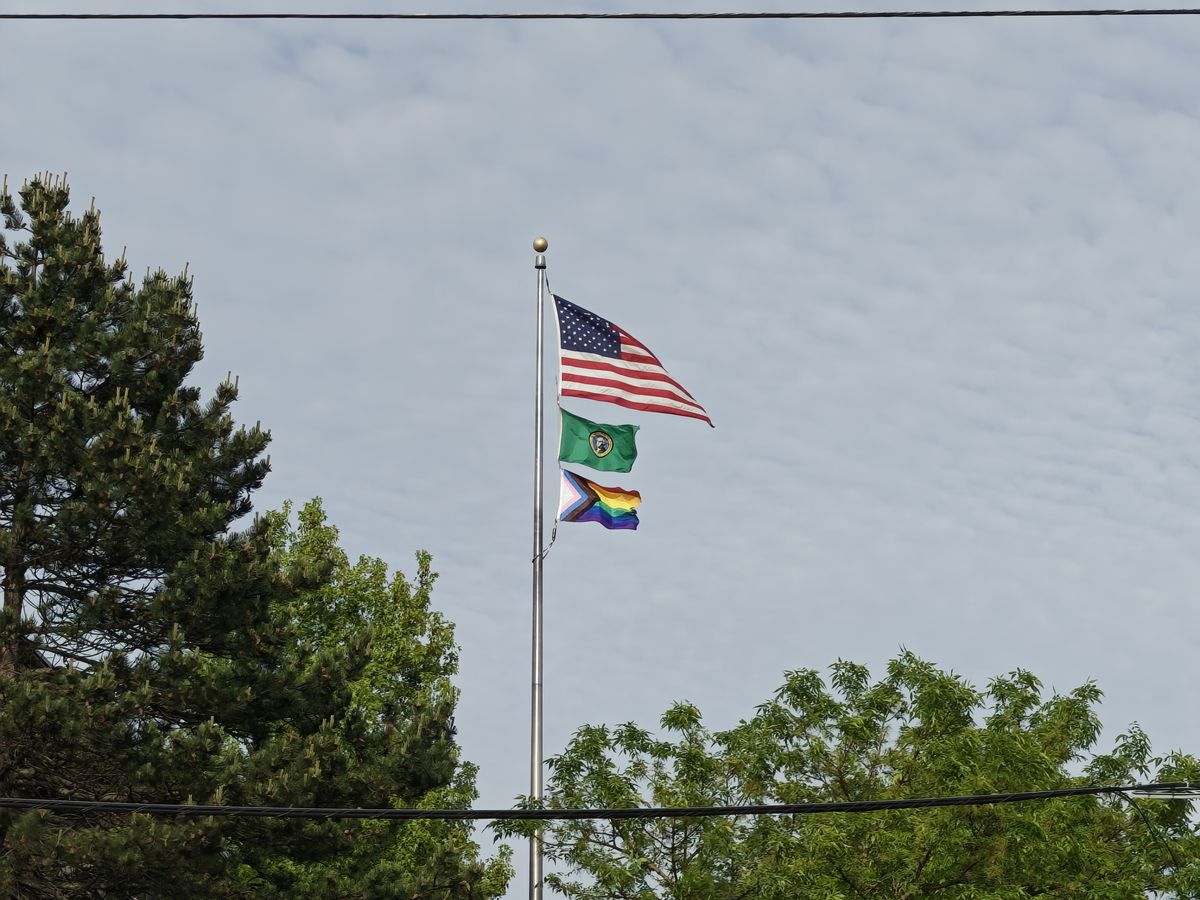 Three flags on a flag pole