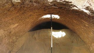 A view from inside a vaulted roof tomb.The hole would likely have been created by tomb robbers at some point in time.