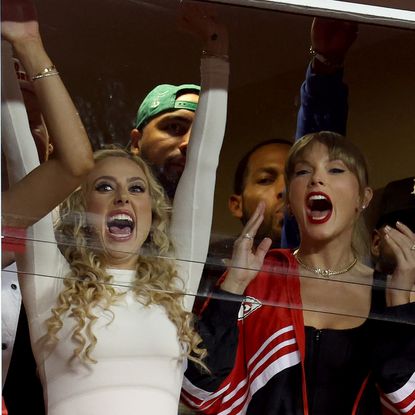 Lyndsay Bell, Brittany Mahomes and Taylor Swift celebrate a touchdown by the Kansas City Chiefs against the Denver Broncos during the second quarter at GEHA Field at Arrowhead Stadium on October 12, 2023 in Kansas City, Missouri. 