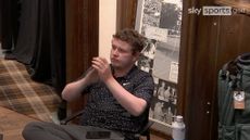 Robert MacIntyre clapping in the clubhouse