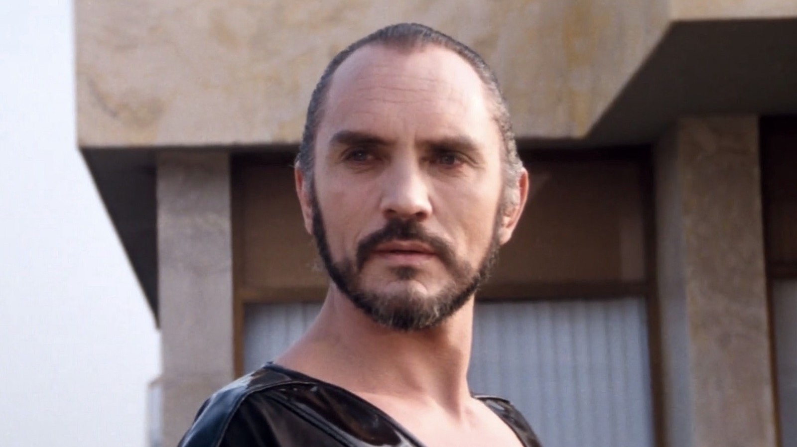 Terence Stamp as General Zod in front of a building