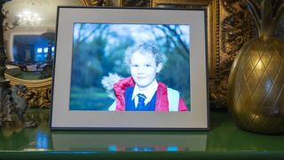 Aura Walden photo frame on sideboard with various household objects