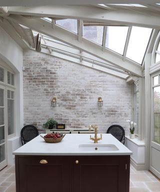 A bright traditional kitchen with quartz countertop island