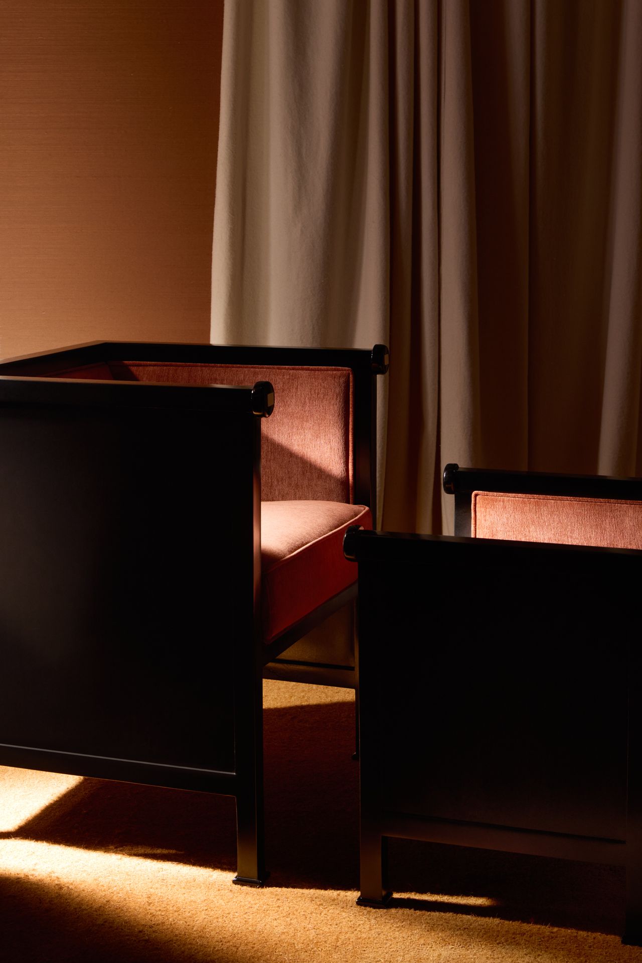 armchairs next to a curtain