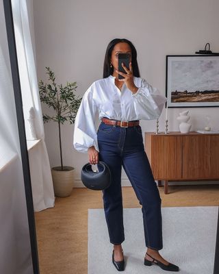 @femmeblk wearing jeans, a white shirt and low block heels