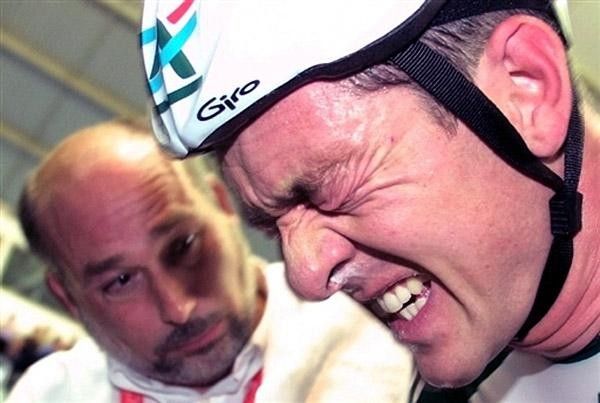 English Chris Boardman grimaces as his coach Michel Docok (L) looks at him