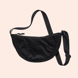 flat lay image of black crossbody bag