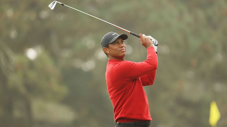 Tiger Woods hits a golf shot