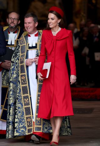 Kate Middleton wearing a red coat walking out of Westminster Abbey on Commonwealth Day 2025