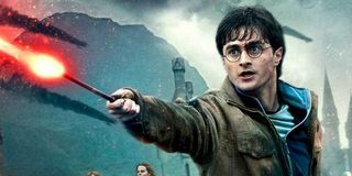 Harry Potter and the Deathly Hallows Part II Daniel Radcliffe using his wand mid-battle