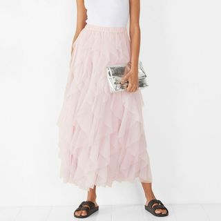 model wearing pink Hush Ruffled Skirt