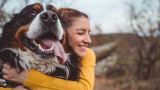 Woman hugging dog