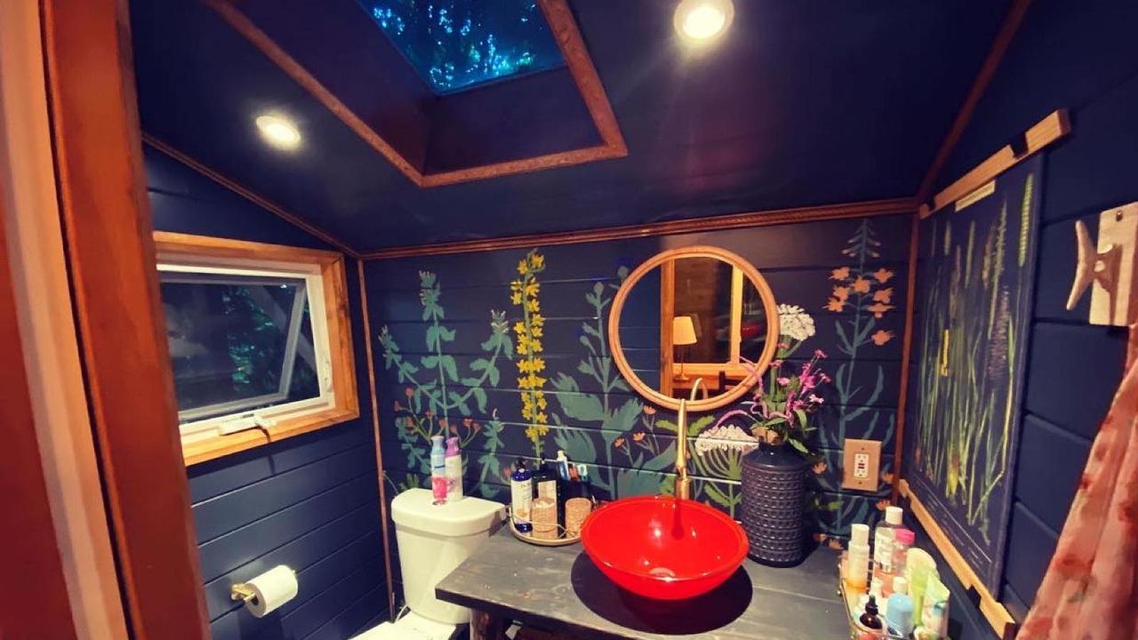 bathroom makeover with wall mural and red sink