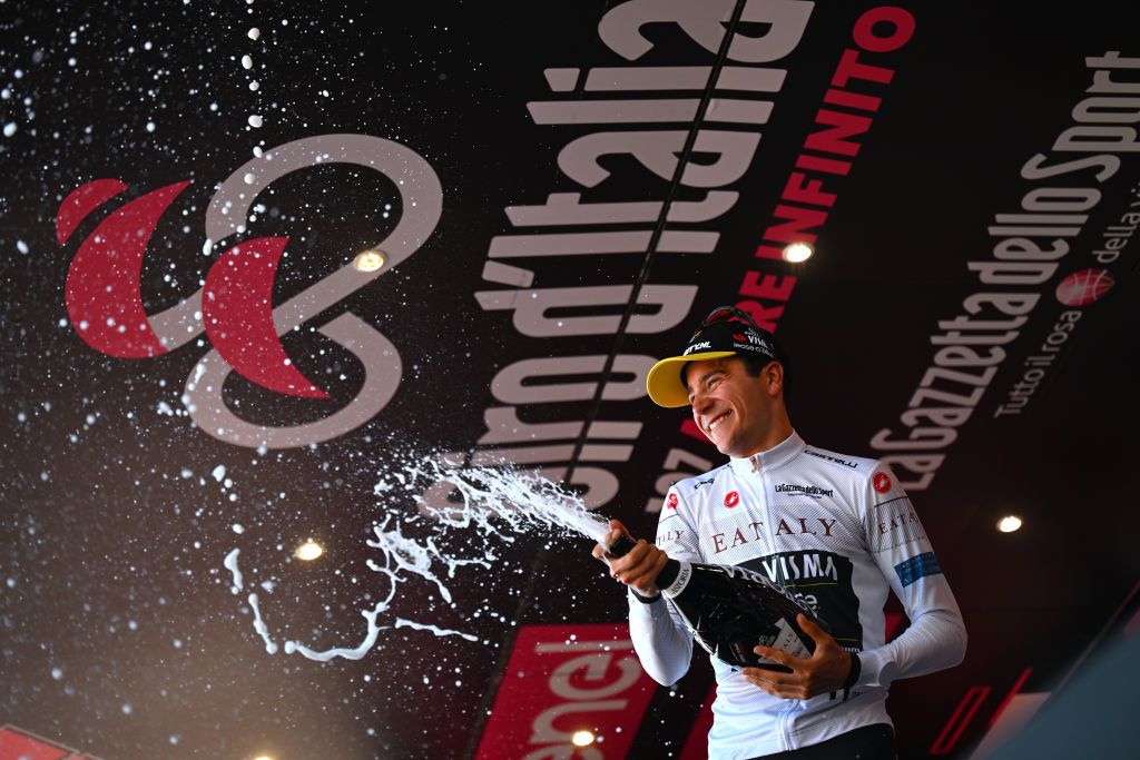 ANDORA ITALY MAY 07 Cian Uijtdebroeks of Belgium and Team Visma Lease a Bike White Best Young Jersey celebrates at podium during the 107th Giro dItalia 2024 Stage 4 a 190km stage from Acqui Terme to Andora UCIWT on May 07 2024 in Andora Italy Photo by Tim de WaeleGetty Images