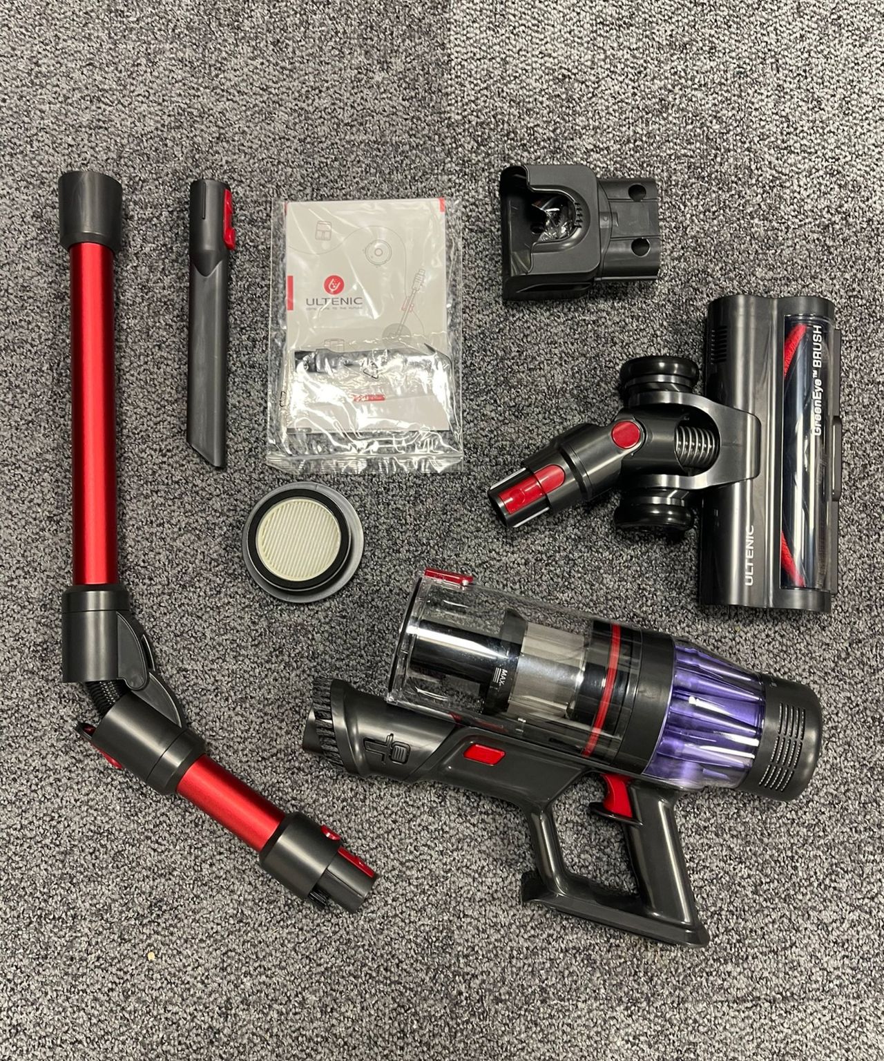 All parts and attachments of the Ultenic U16 Flex on gray carpet in Future's test center