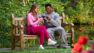Pfeifer Hill and Derrick Fleming drink wine as they talk on a bench on Age of Attraction.