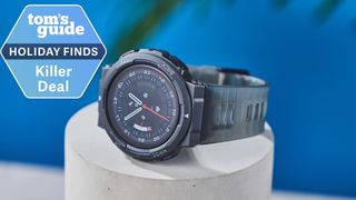 Amazfit Active Edge smartwatch on a table next to a deals badge